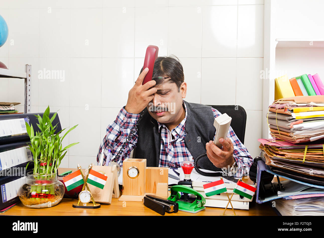 1 indian Man Government Employee office sitting Working problem Telephone Talking Stock Photo