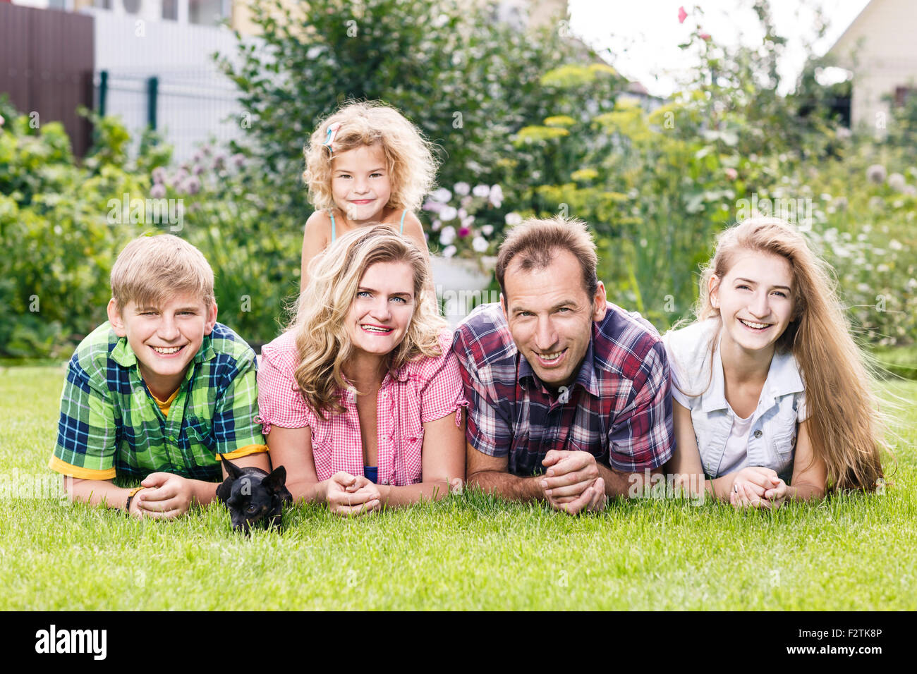 Happy family having weekend in summer park Stock Photo