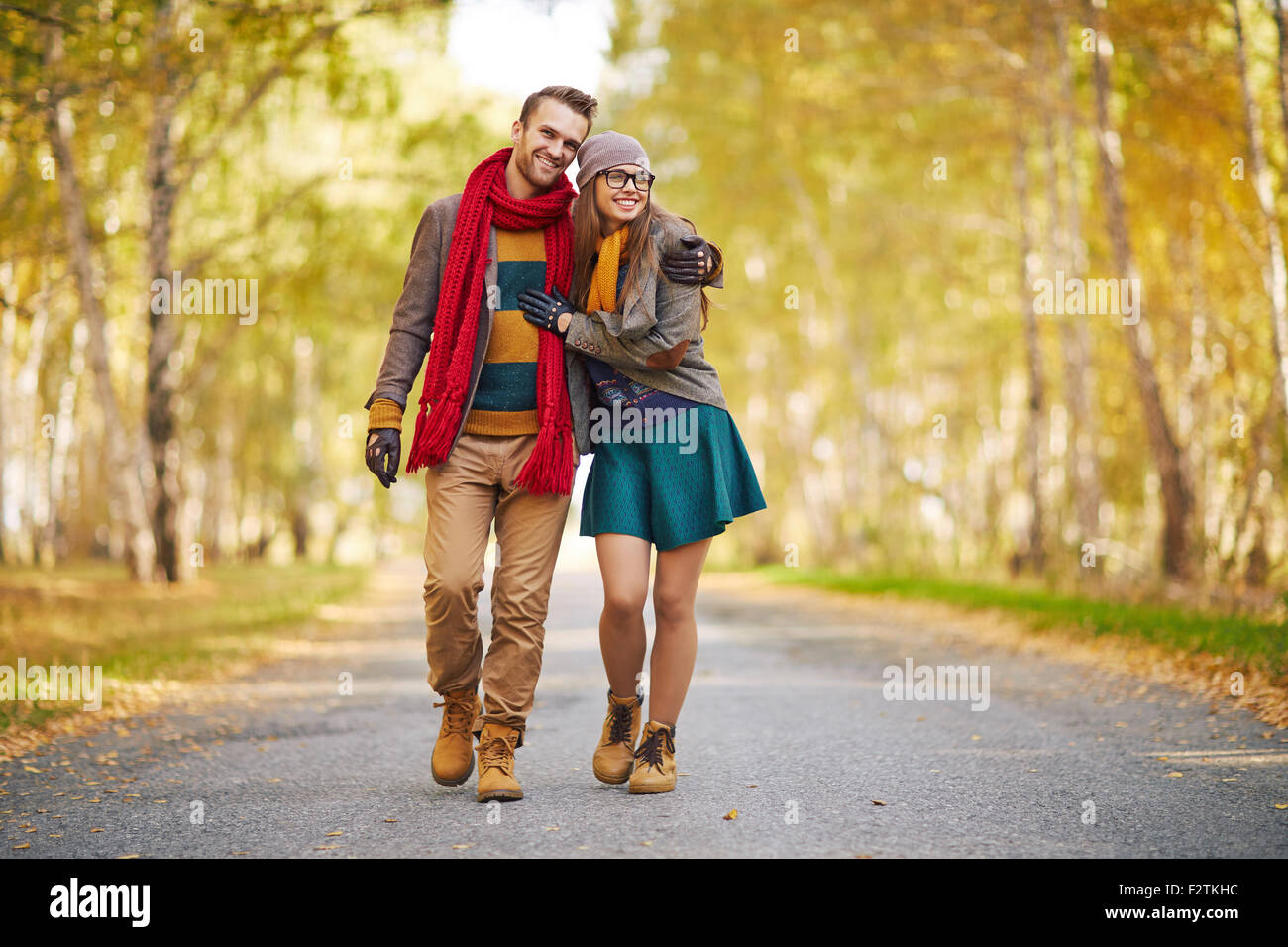 Stylish young couple enjoying walk in park Stock Photo - Alamy