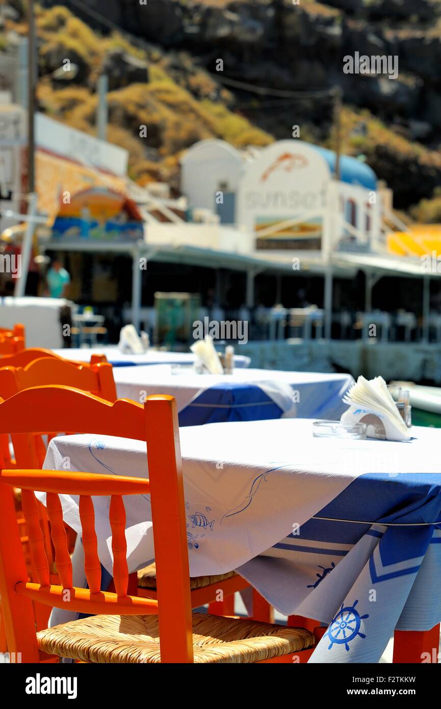 Fish Restaurant table and chairs in Amoudi bay Santorini Greece Stock Photo
