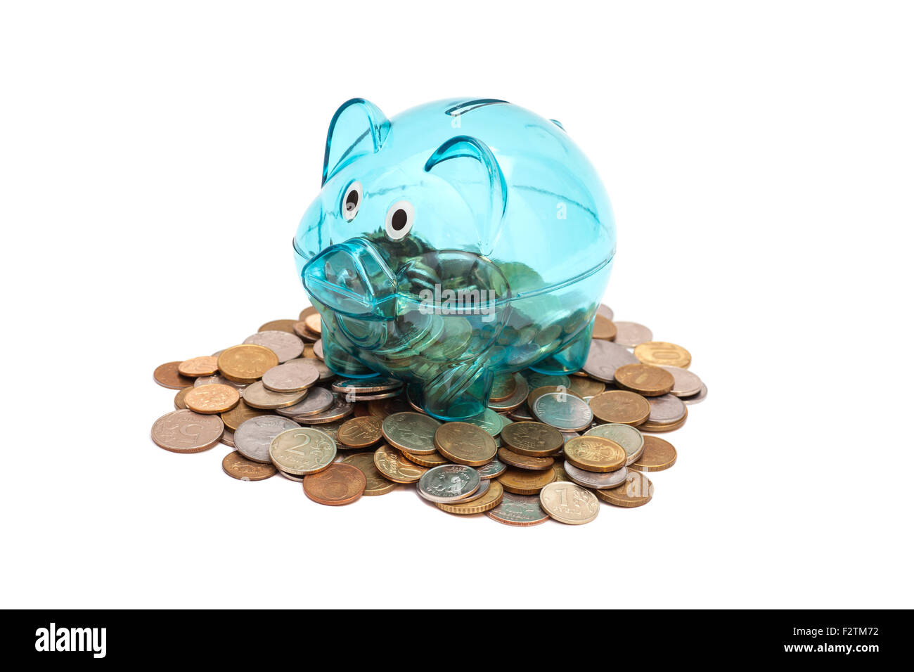Glass Piggy Bank And Coins Stock Photo