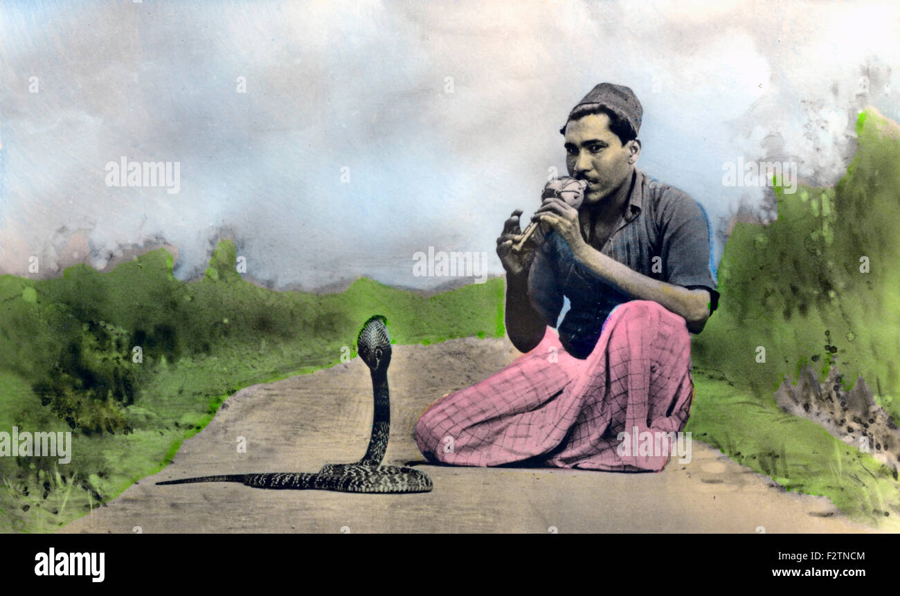 Snake charmer with a cobra (Naja naja), ca. 1910, India Stock Photo