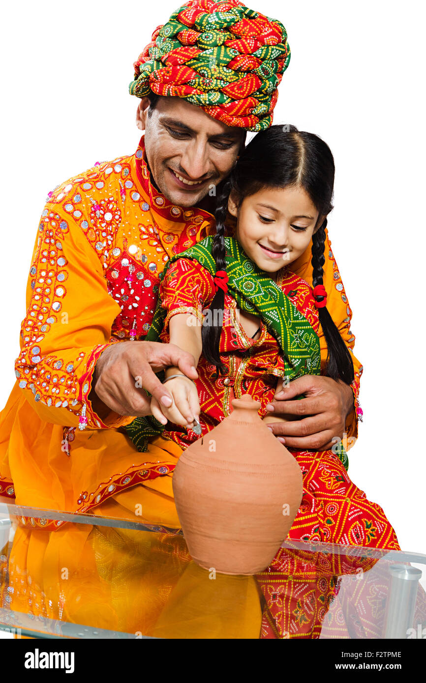 2 indian Rajasthani Villager father and daughter Piggy Bank Saving ...