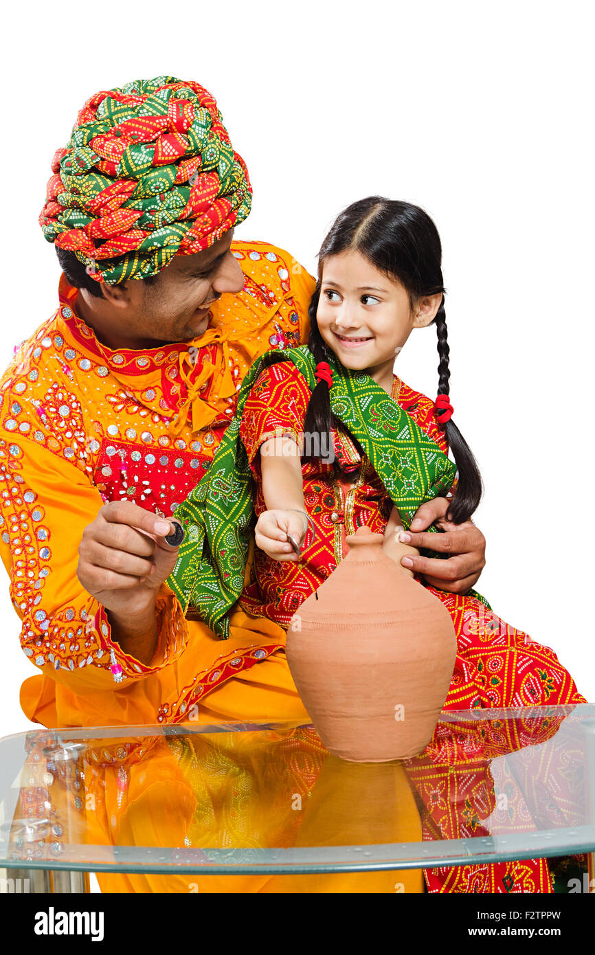 2 indian Rajasthani Villager father and daughter Piggy Bank Saving ...