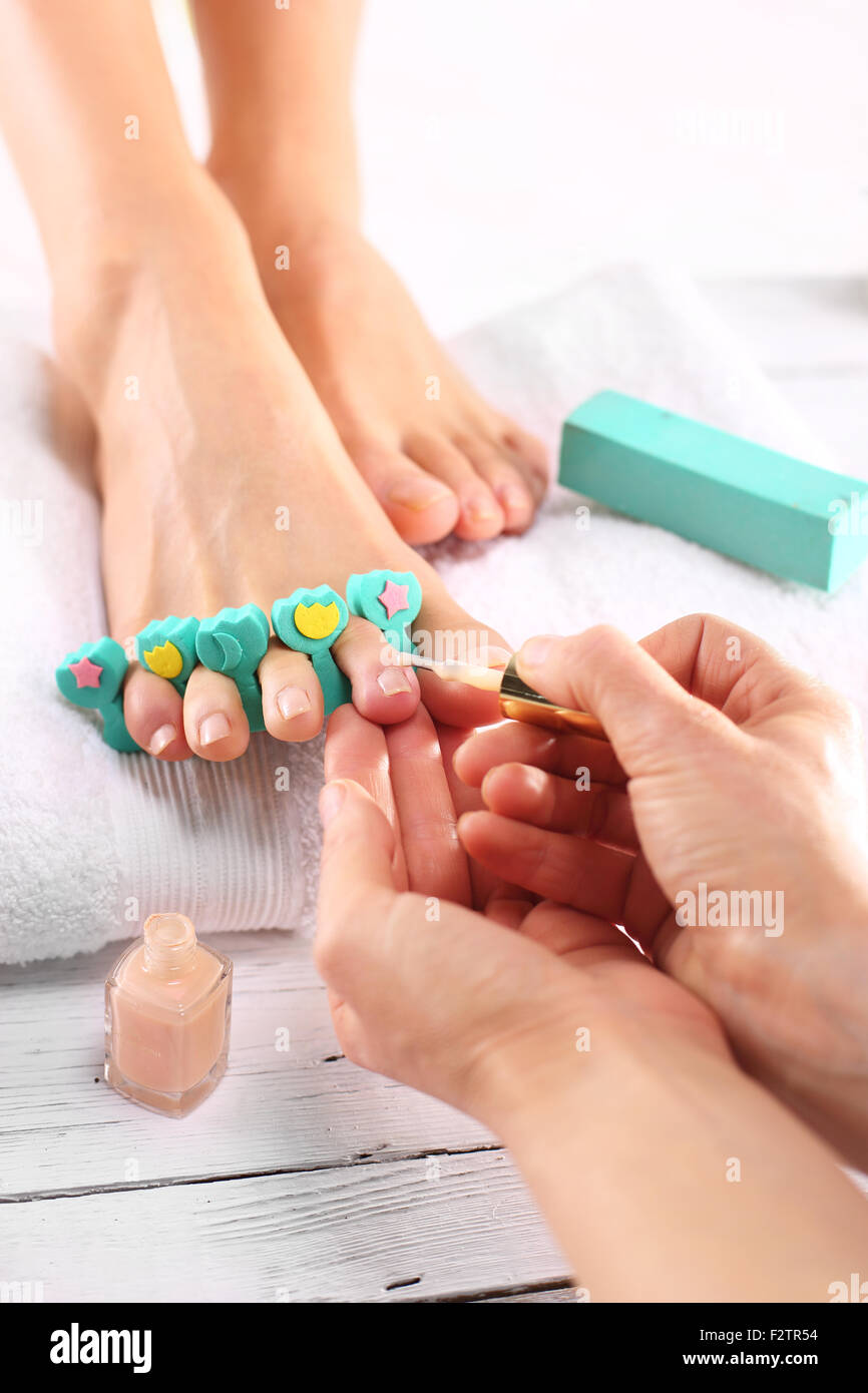 Painting toenails. Pedicure, beautiful healthy nails.Pedicure, cut peel