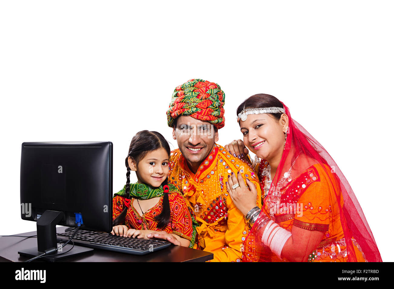 3 indian Rajasthani Villager Parents and daughter Computer Education Stock Photo