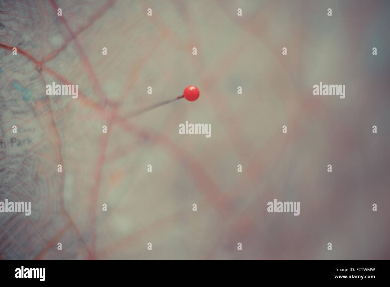 A red pin placed on a city map Stock Photo - Alamy