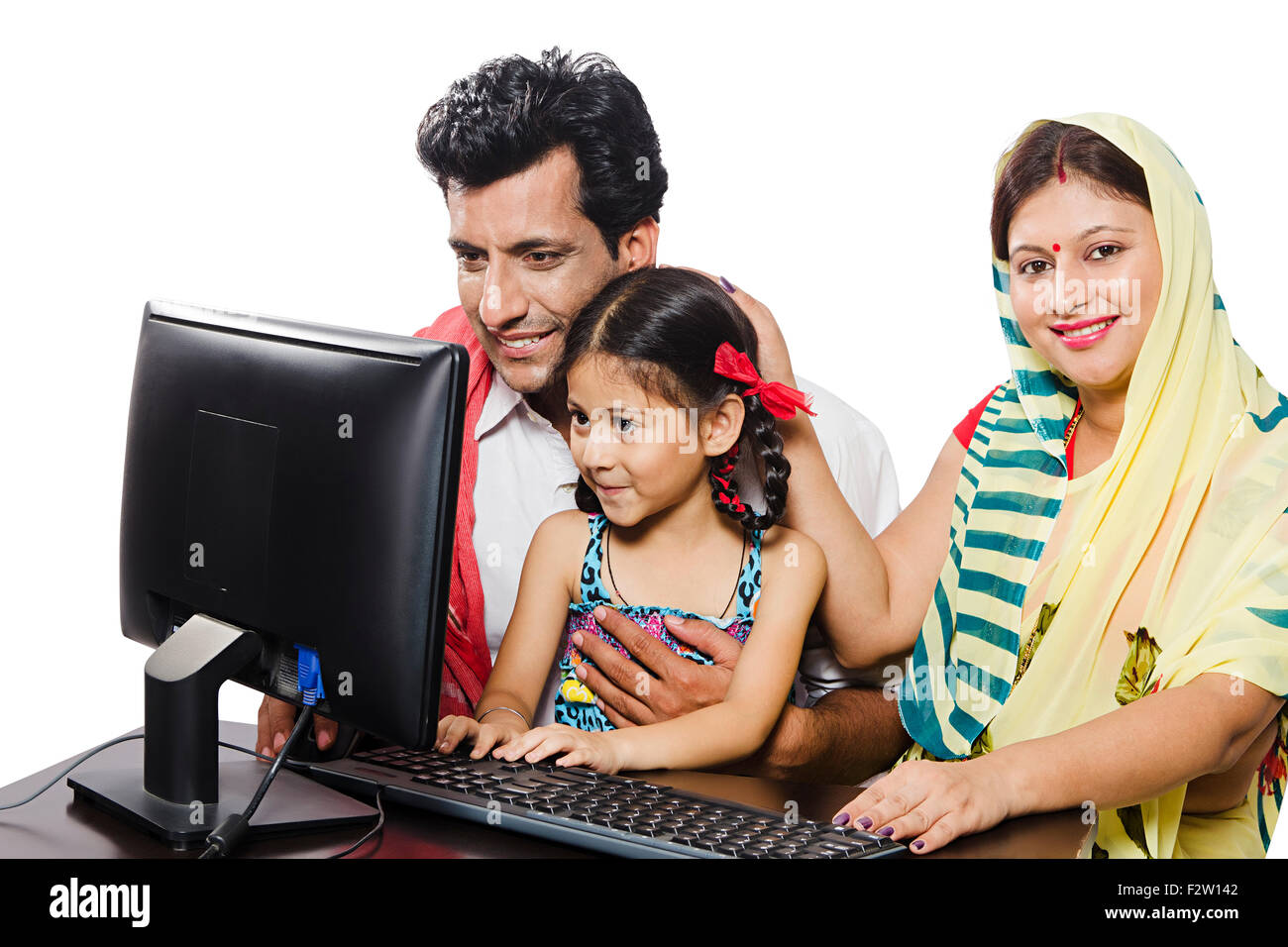 3 indian  Rural farmer Parents and daughter Computer Education Stock Photo