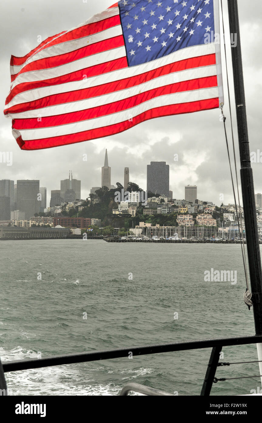 American flag with San Francisco City in the background Stock Photo