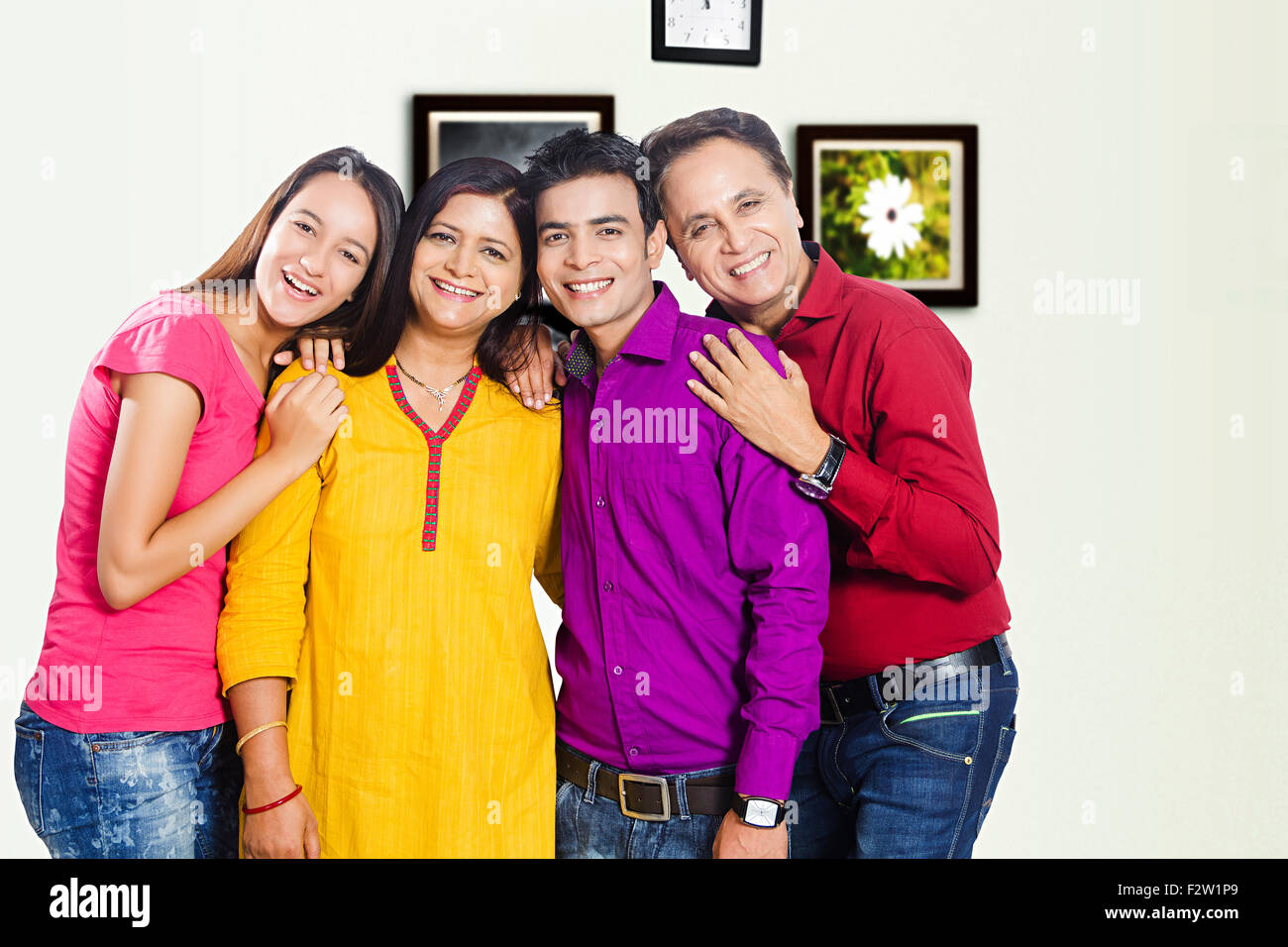 4 indian family Parents daughter and son standing Stock Photo