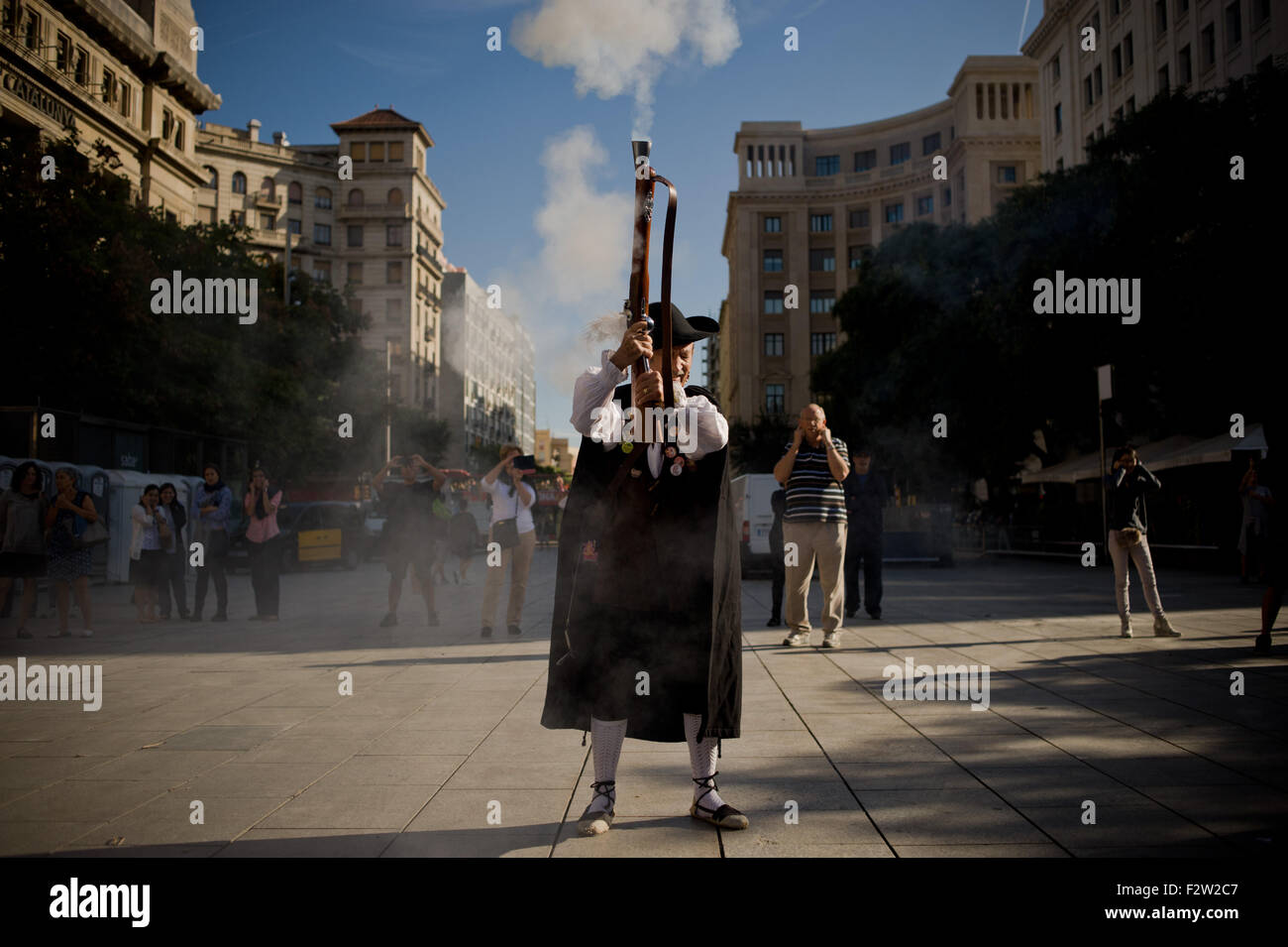 Barcelona, Catalonia, Spain. 24th Sep, 2015. A trabucaire shoots his blunderbuss through the streets of Barcelona on the occasion of the celebrations of the Merce Festival (Festes de la Merce) on 24 September 2015, Spain. The Galejada Trabucairemarks the beginning of the day of the patron saint of Barcelona, La Merce. Men and women dressed as ancient Catalan bandits take to the streets of the old part of Barcelona and cause a loud noise with his blunderbusses full of gunpowder. © Jordi Boixareu/ZUMA Wire/Alamy Live News Stock Photo