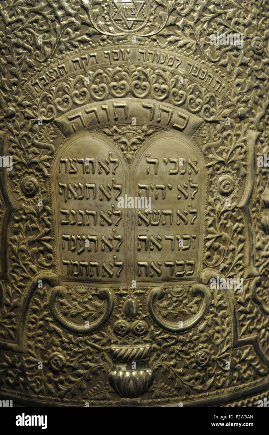 Cylindrical Torah scroll case.Tripoli, Libya,1935. Silversmith: Raphael ‘Aton. Wood overlaid with silver sheet, repoussé. Inscribed in Hebrew with biblical citations, the name of the donor, Bercusa, in memory of her husband, Solomon Raccah, and the year of donation. Detail. Israel Museum. Jerusalem. Stock Photo
