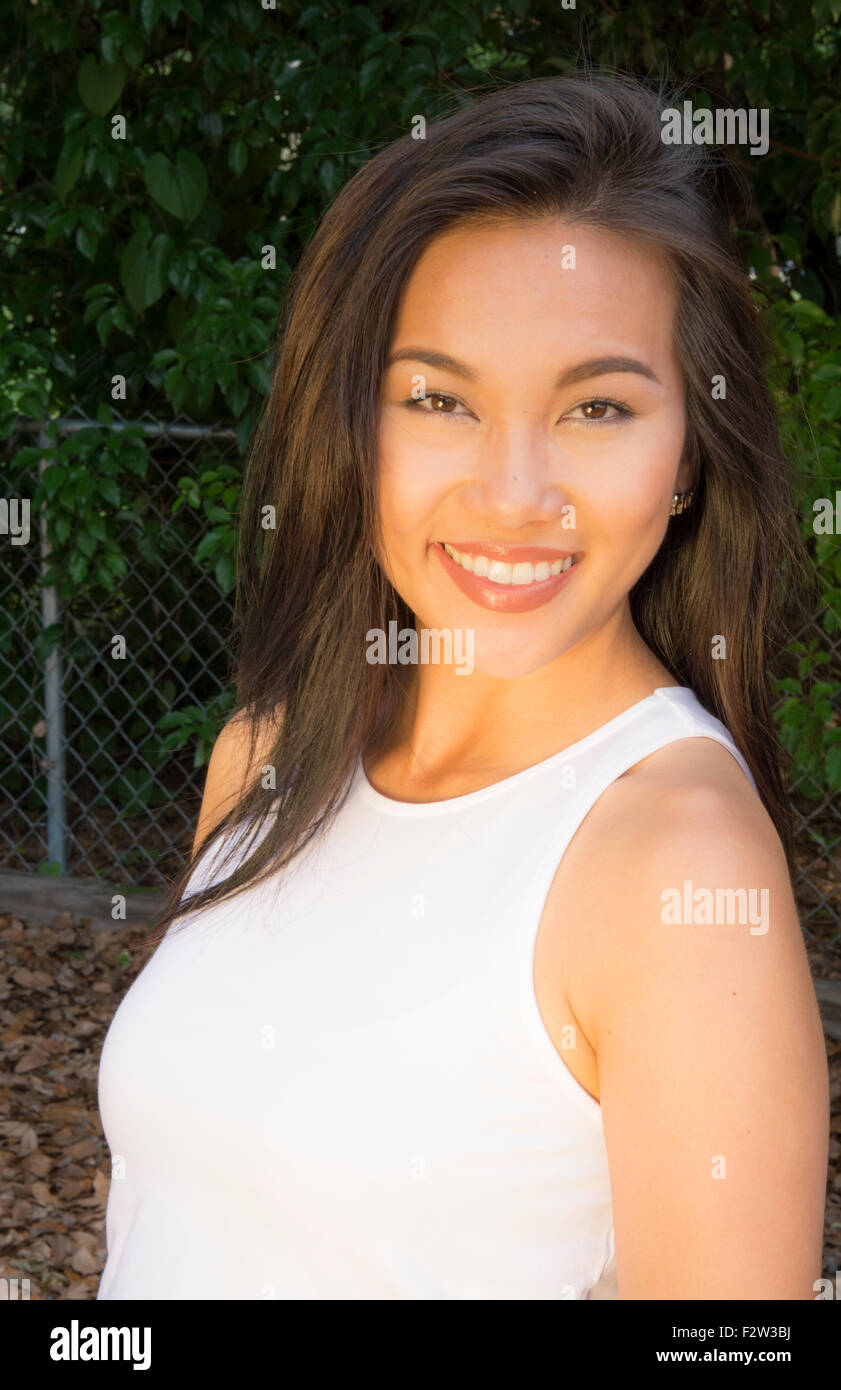 Vietnamese American young woman age 30's portrait outdoors smiling MR-8 Model Released Stock Photo