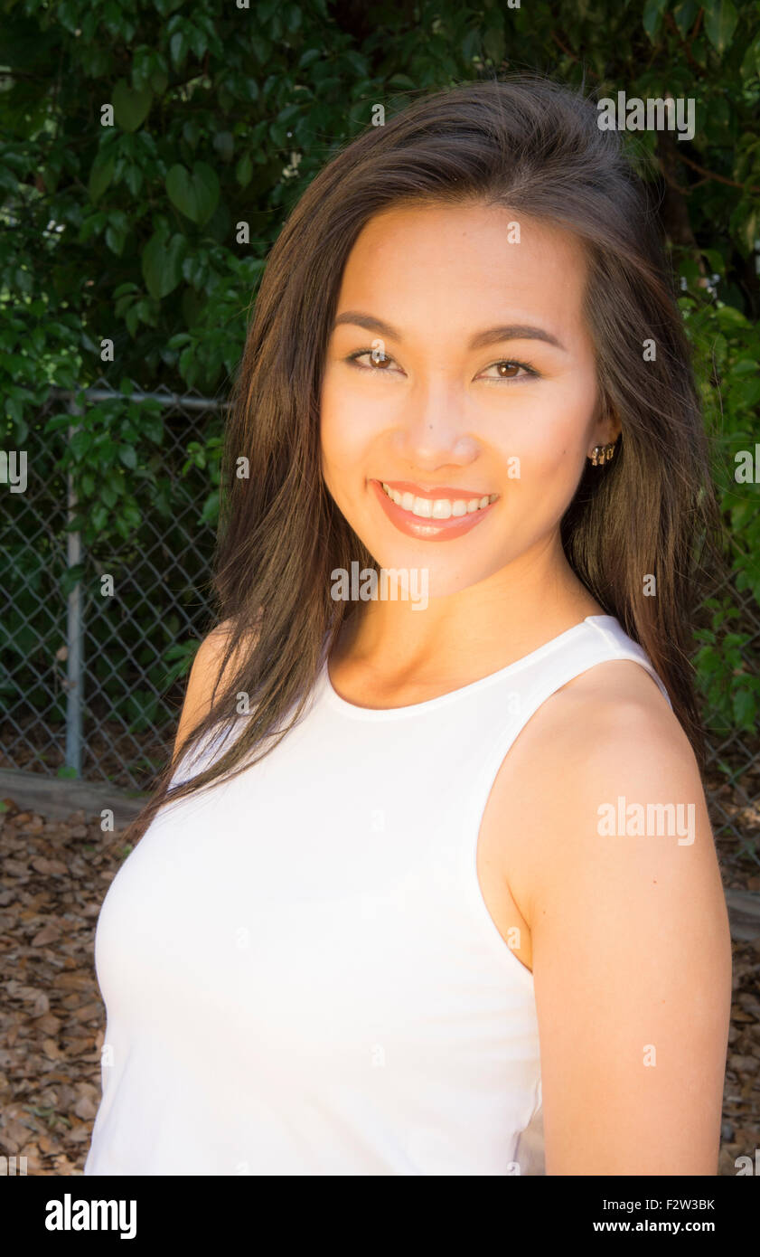 Vietnamese American young woman age 30's portrait outdoors smiling MR-8 Model Released Stock Photo
