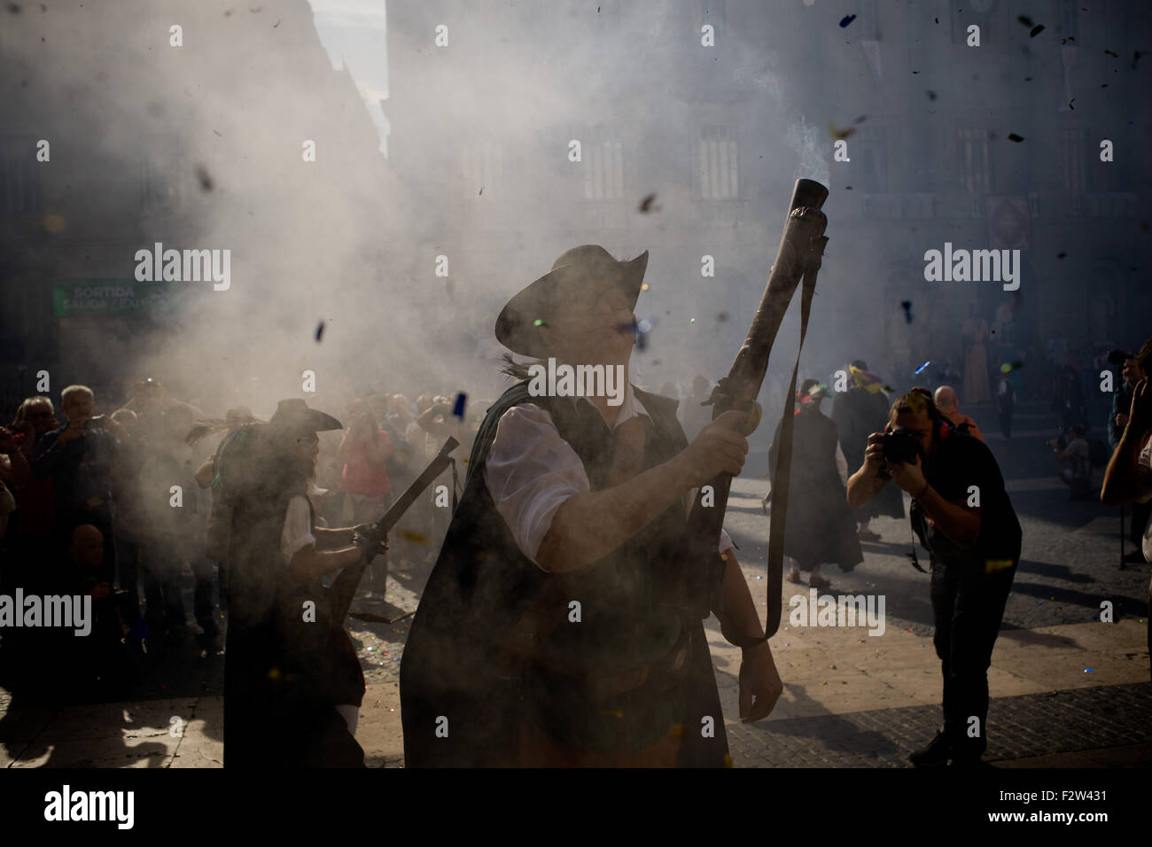 Barcelona, Catalonia, Spain. 24th Sep, 2015. Trabucaires shoot his blunderbuss through the streets of Barcelona on the occasion of the celebrations of the Merce Festival (Festes de la Merce) on 24 September 2015, Spain. The Galejada Trabucairemarks the beginning of the day of the patron saint of Barcelona, La Merce. Men and women dressed as ancient Catalan bandits take to the streets of the old part of Barcelona and cause a loud noise with his blunderbusses full of gunpowder. © Jordi Boixareu/ZUMA Wire/Alamy Live News Stock Photo