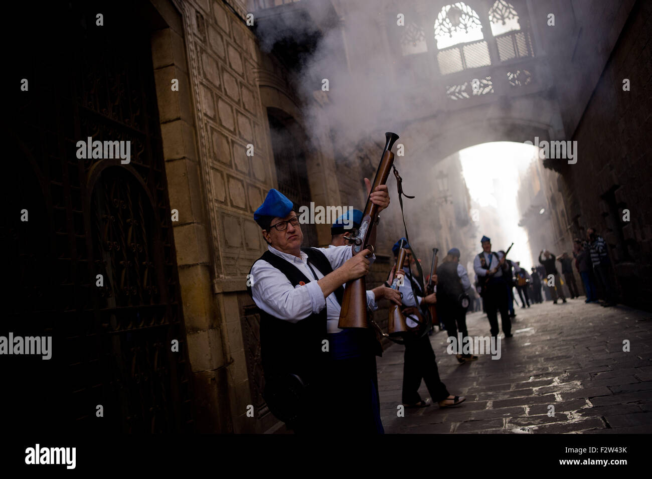 Barcelona, Spain. 24th September, 2015. Trabucaires  shoot his blunderbuss through the streets of Barcelona on the occasion of the celebrations of the Merce Festival (Festes de la Merce) on 24 September 2015, Spain. The Galejada Trabucaire marks the beginning of the day of the patron saint of Barcelona, La Merce. Men and women dressed as ancient Catalan bandits take to the streets of the old part of Barcelona and cause a loud noise with his blunderbusses full of gunpowder. Credit:   Jordi Boixareu/Alamy Live News Stock Photo