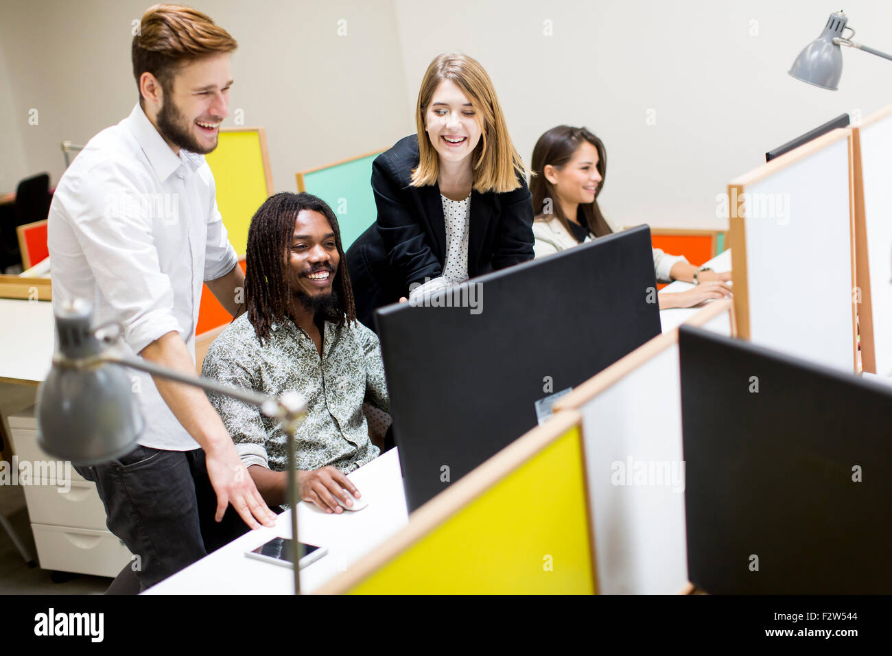 Young people in the office Stock Photo - Alamy