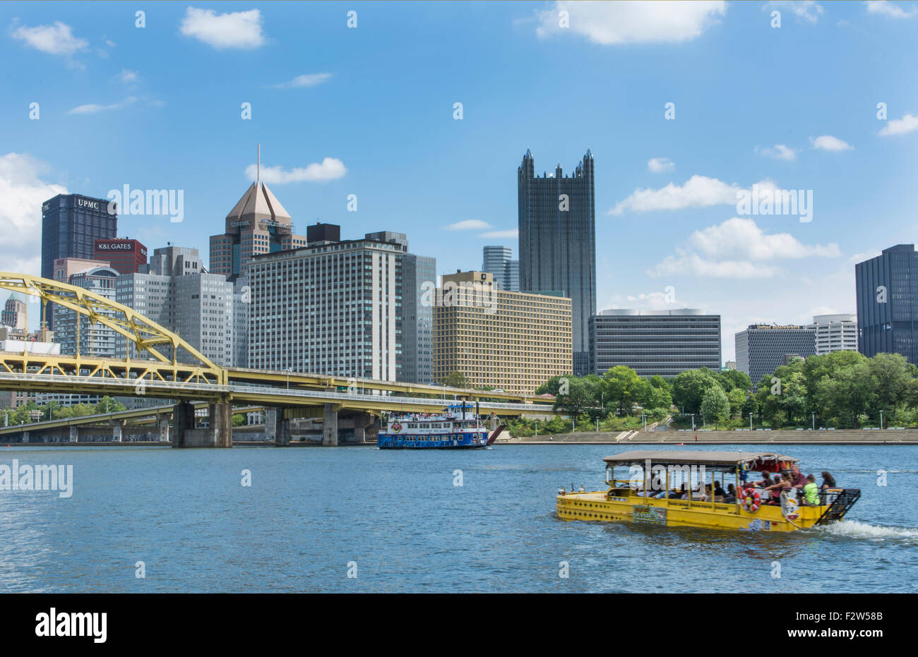 Pittsburgh Pennsylvania PA downtown skyline skyscrapers with famous Just Ducky Tours boat going around city and Roberto Clemente Stock Photo