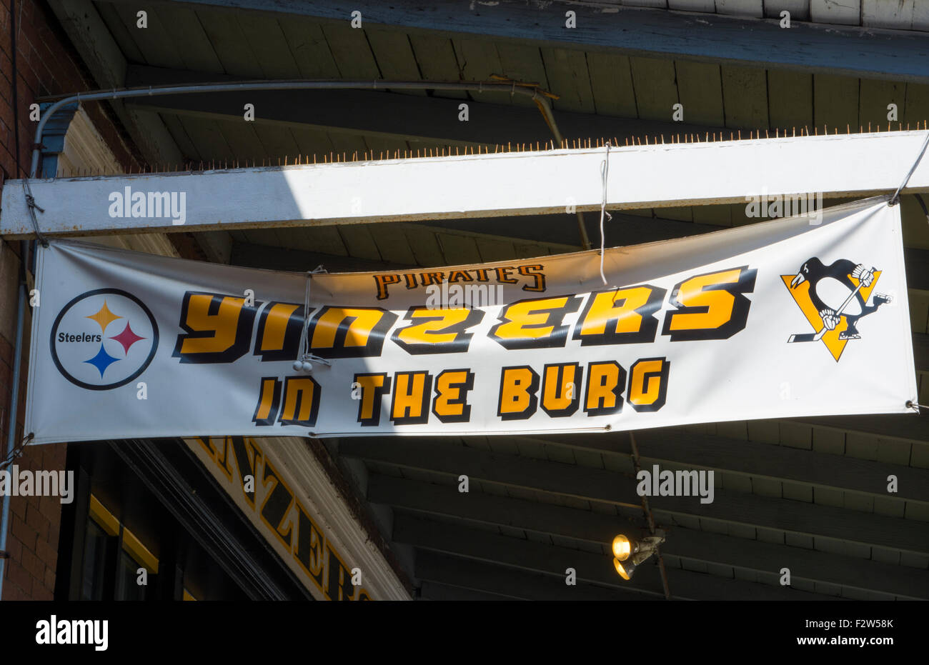 Pittsburgh Pennsylvania PA the famous Strip District with shops selling sports souvenirs of YINZERS, YINZ, BURG, Stock Photo
