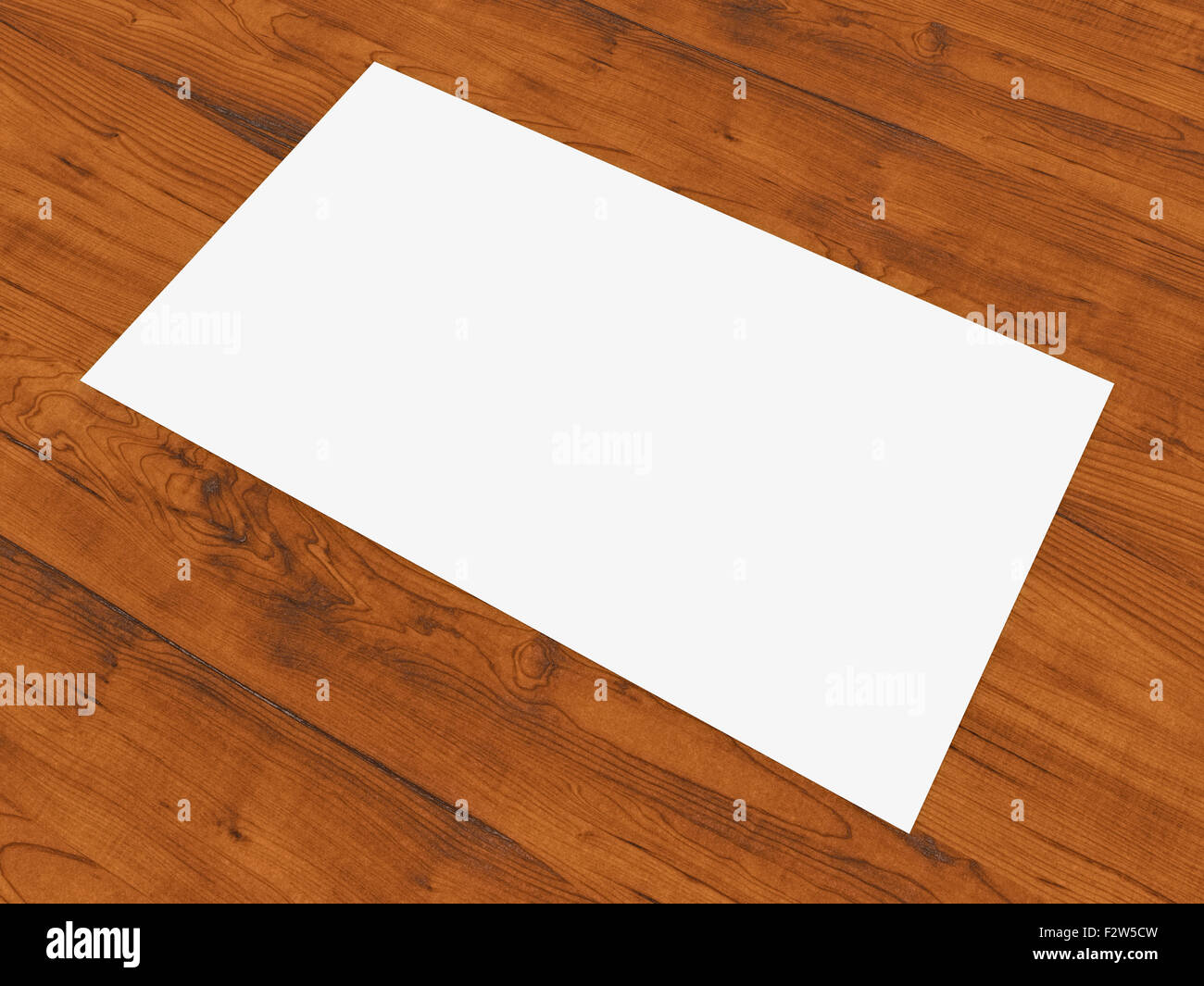 Blank business card resting on wood surface. Stock Photo