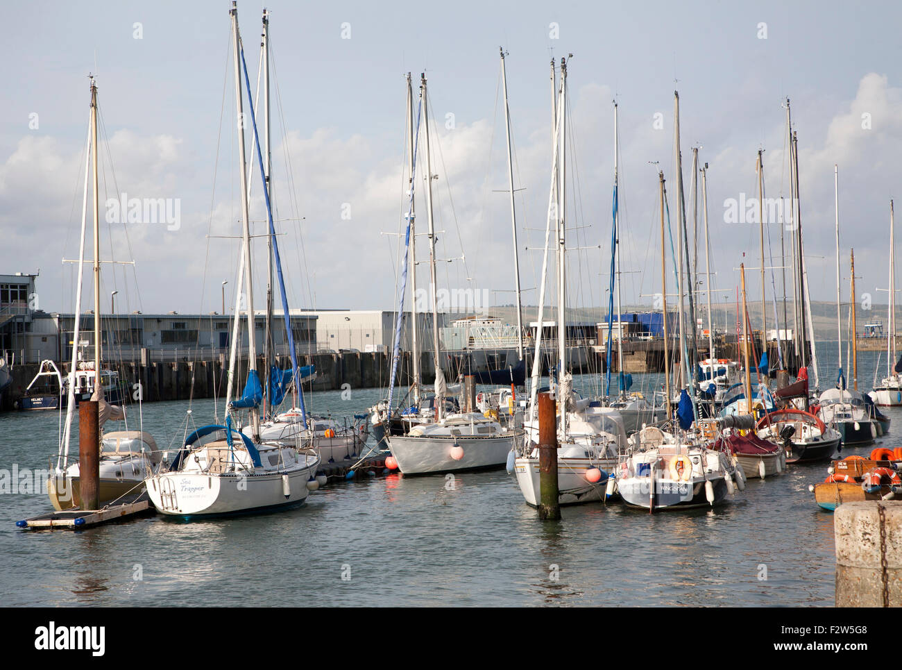 Modern yachts at moorings in the harbour at Weymouth, Dorset, England ...