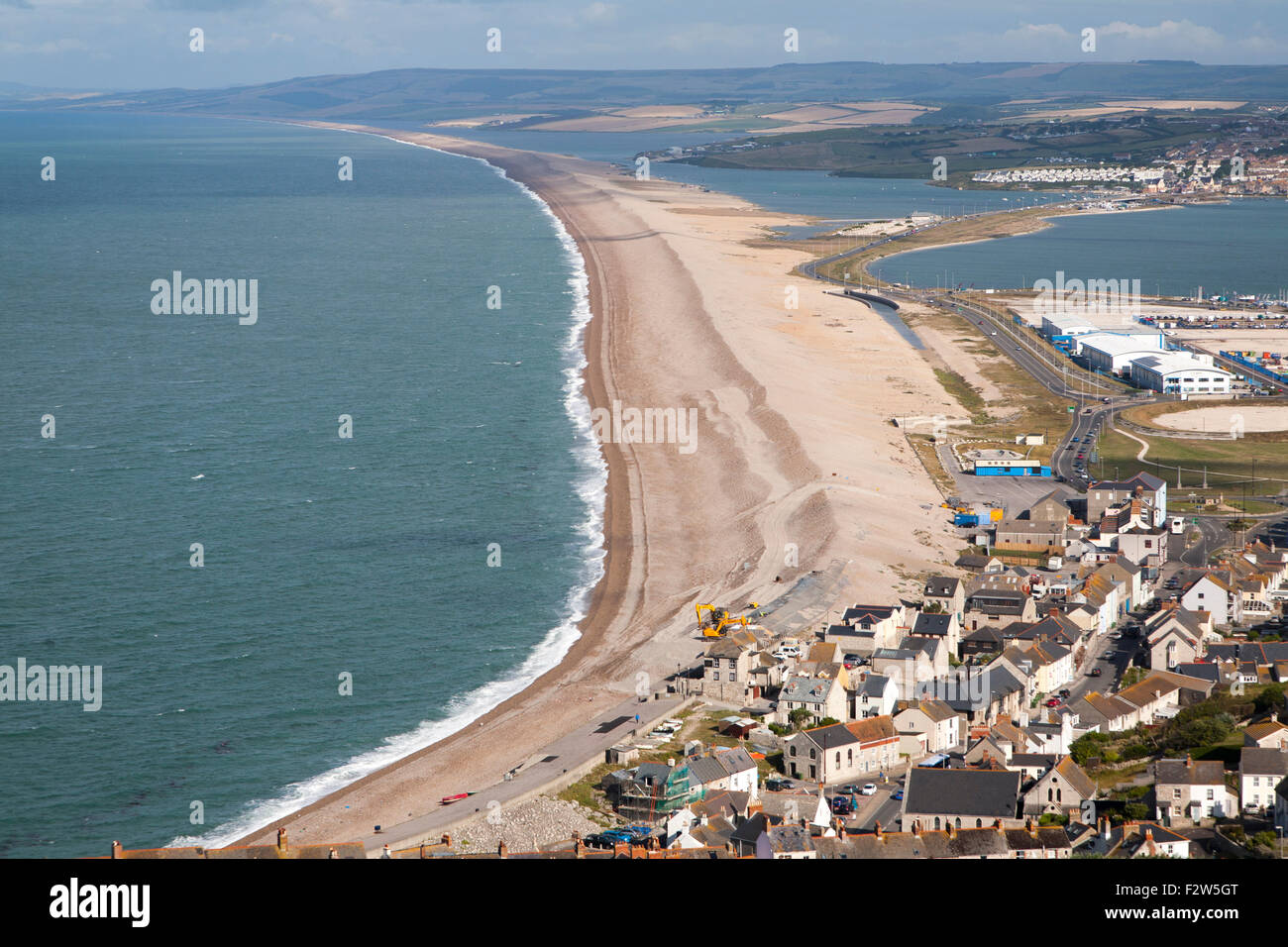 Chesil beach tombolo with housing in Chiswell in the foreground, Isle