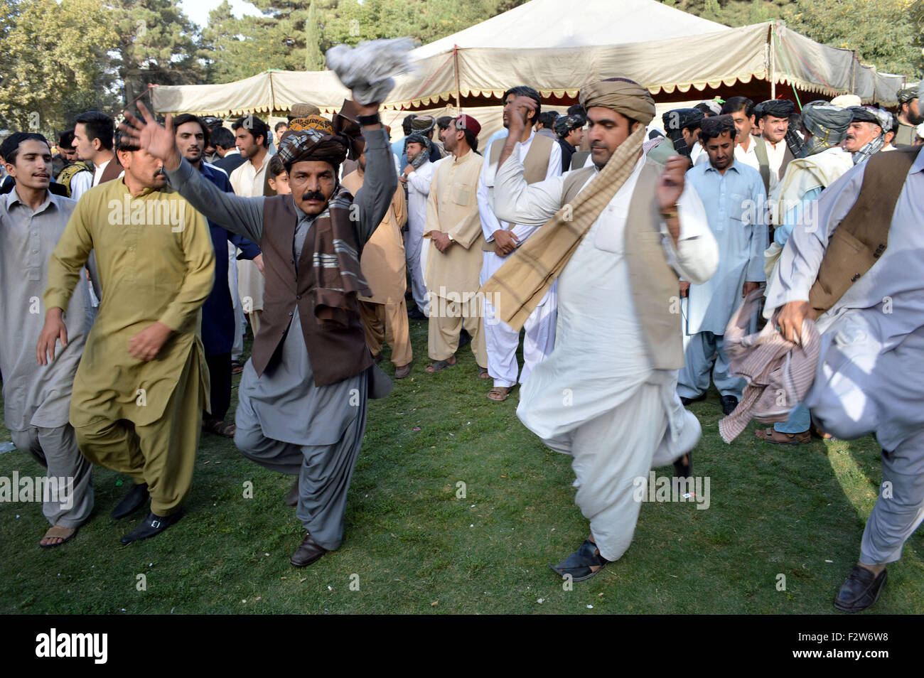 Quetta. 23rd Sep, 2015. People dance on the beat of drum during a ceremony marking Pashtun Cultural Day in southwest Pakistan's Quetta, Sept. 23, 2015. © Irfan/Xinhua/Alamy Live News Stock Photo