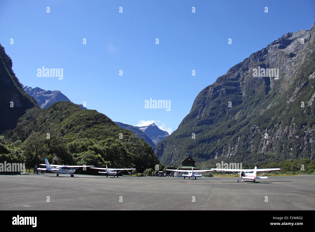 Small planes on the runway of the Milford Sound Airport, MFN, NZMF, in Milford Sound, New Zealand Stock Photo