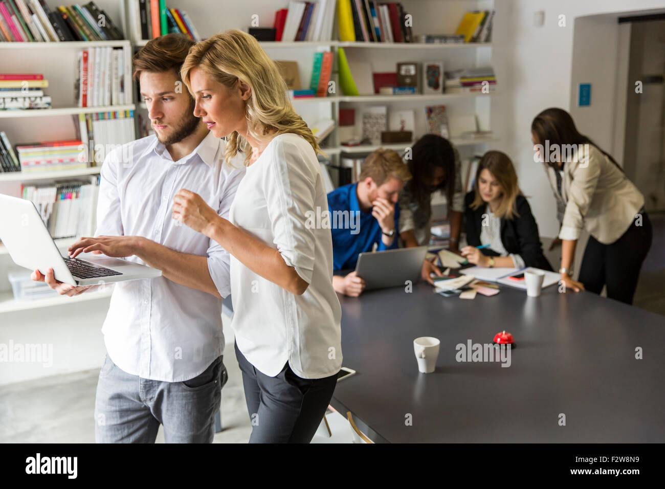Young people in the office Stock Photo - Alamy