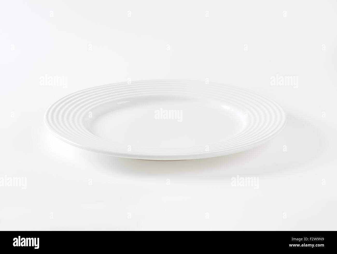 empty white plate on white background Stock Photo - Alamy