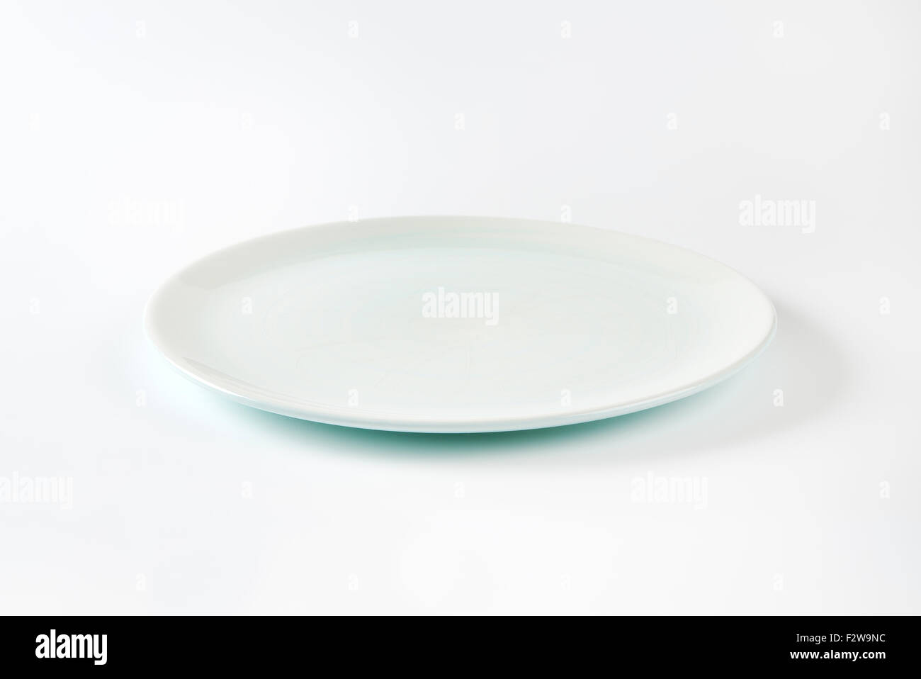 empty white plate on white background Stock Photo - Alamy
