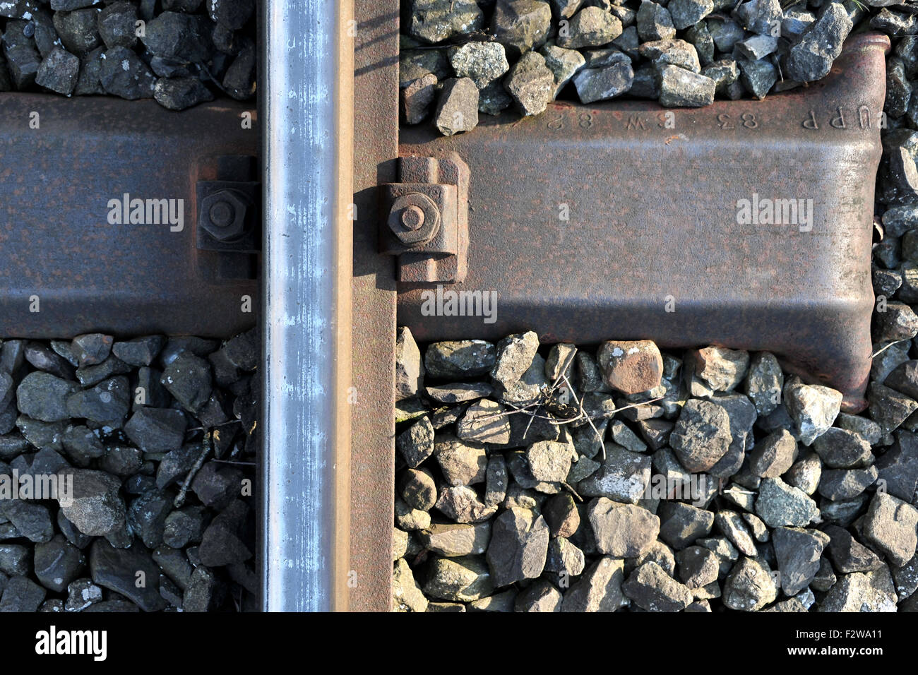 09.05.2015, Sandkrug, Lower Saxony, Germany - Detailed picture of rails in the track bed. 0HD150509D045CAROEX.JPG - NOT for Stock Photo