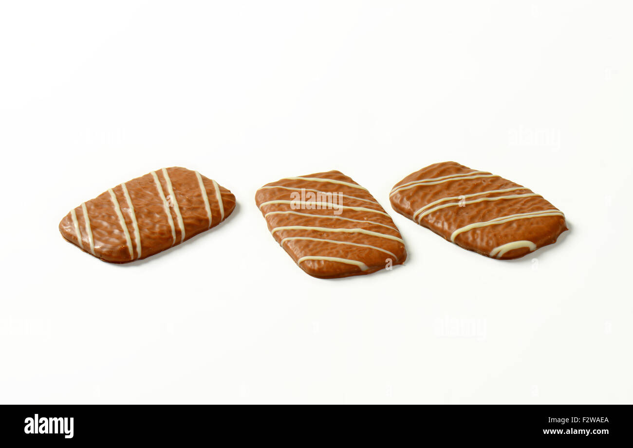 three chocolate biscuits on white background Stock Photo