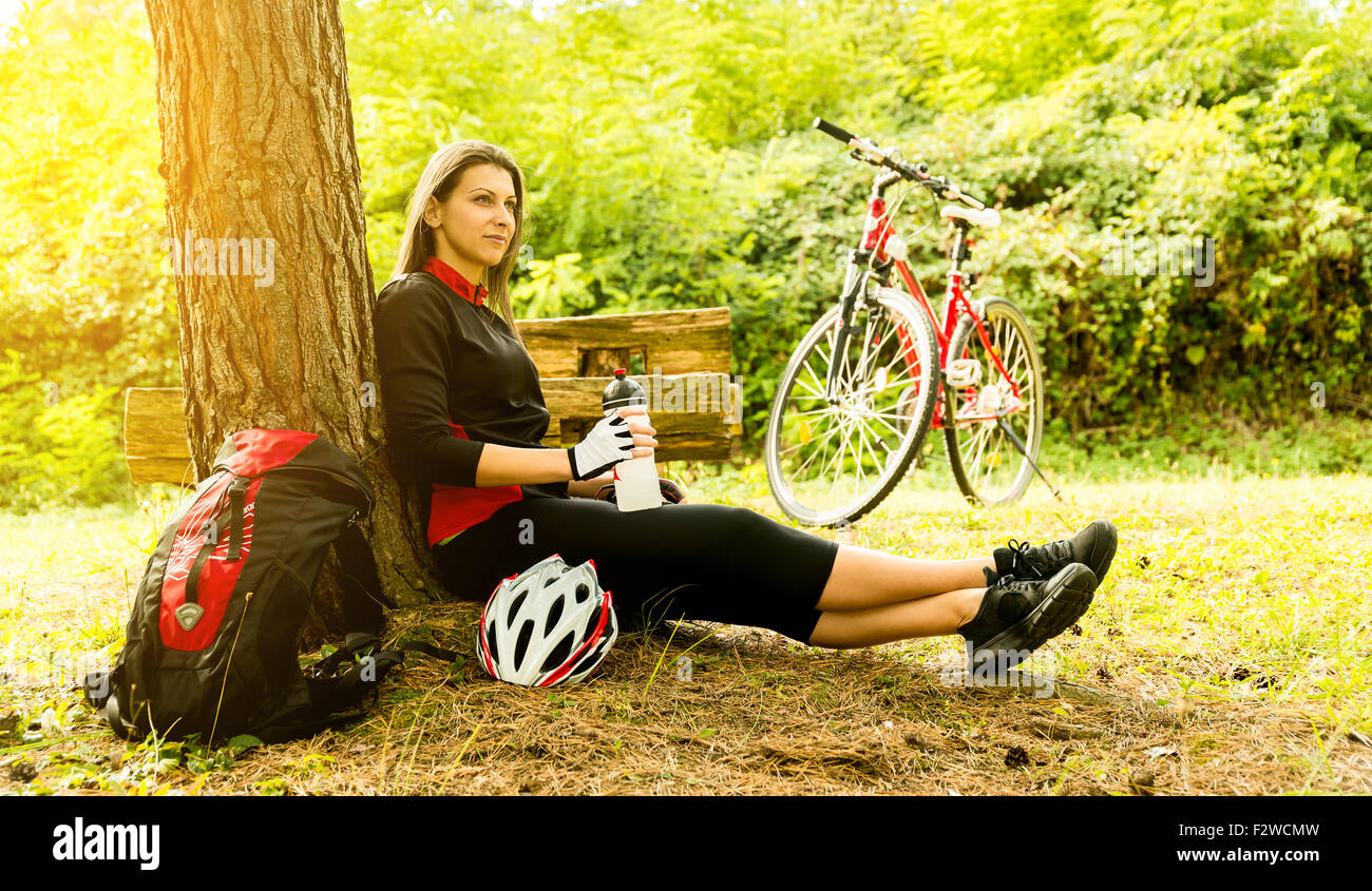 Happy Young Woman riding bicycle outside. Healthy Lifestyle. Stock Photo