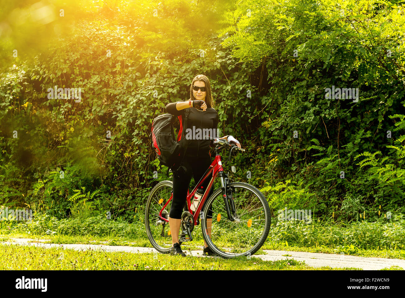 Happy Young Woman riding bicycle outside. Healthy Lifestyle Stock Photo ...