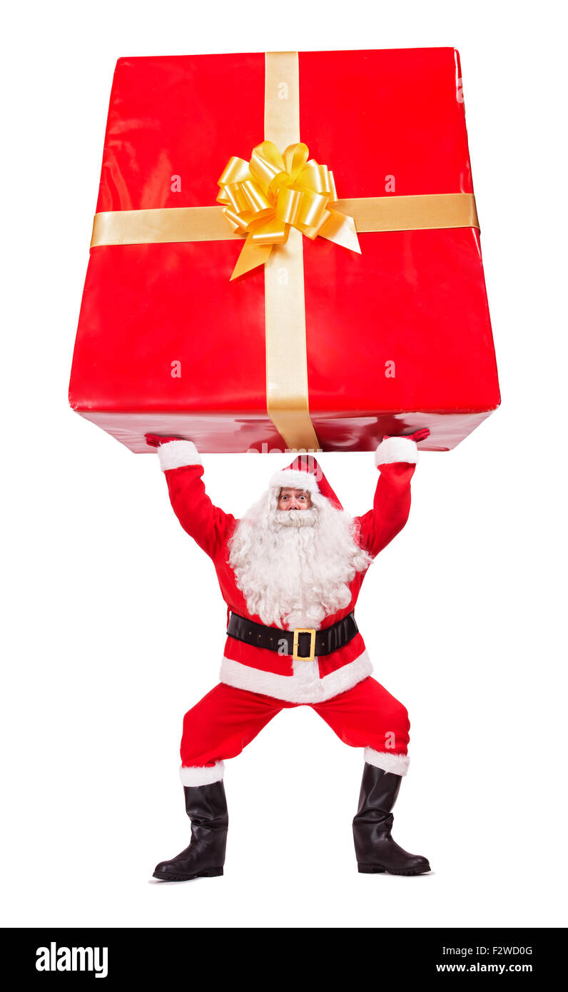 Santa Claus carries Christmas gift isolated on white background Stock Photo