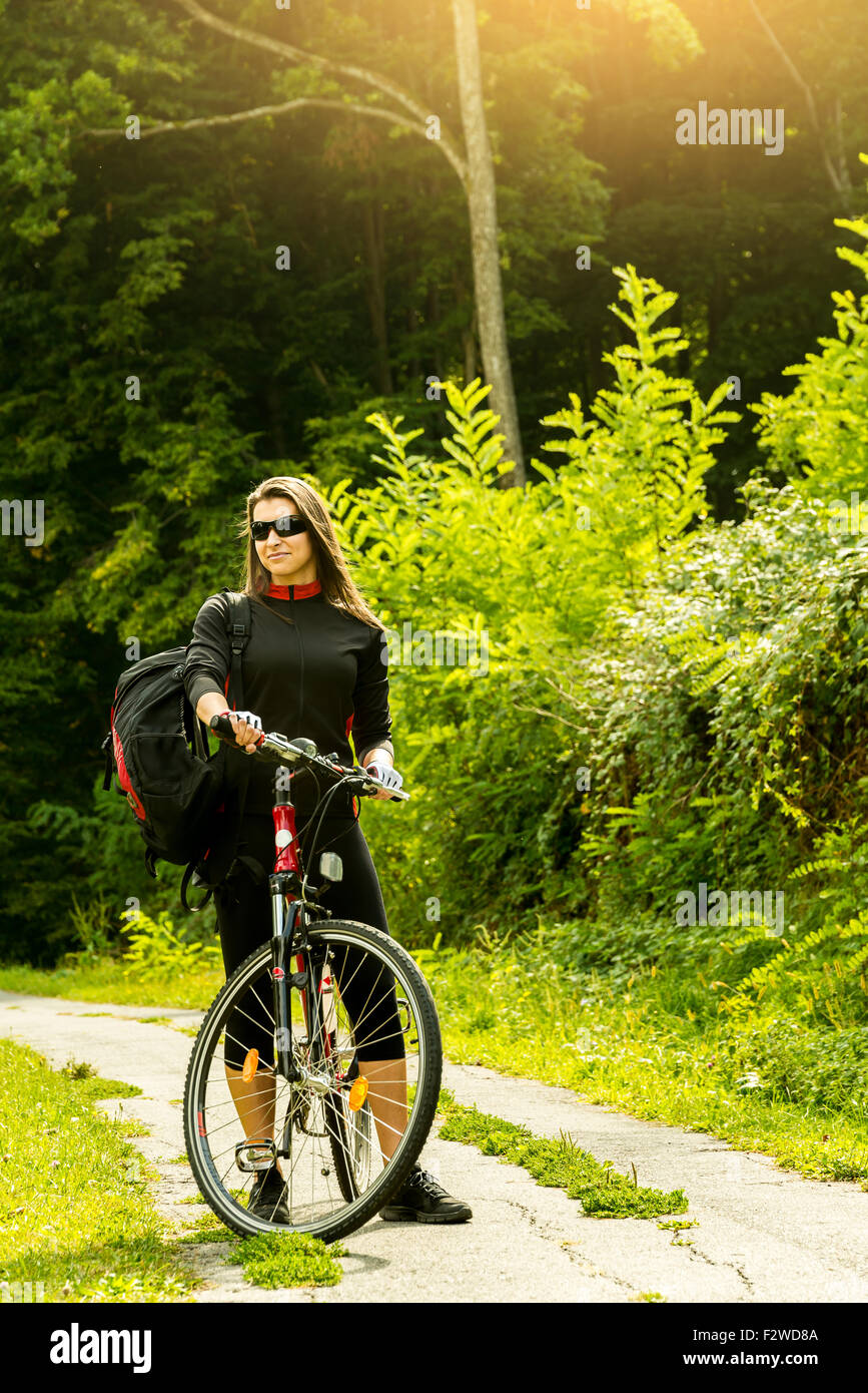 Happy Young Woman riding bicycle outside. Healthy Lifestyle Stock Photo ...