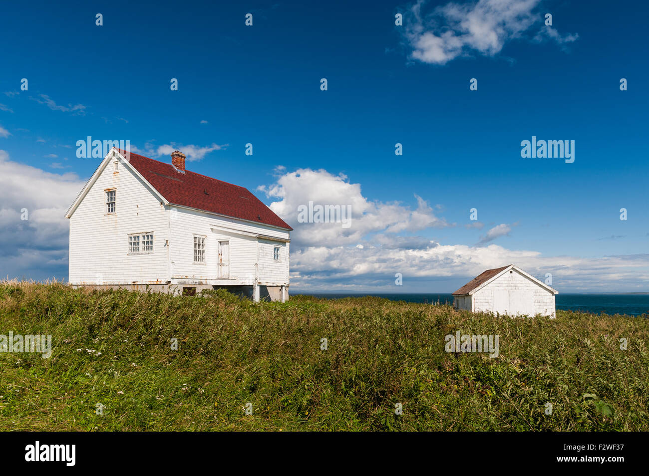 old wooden fishermen house and shed with red roofs in LonguePointede