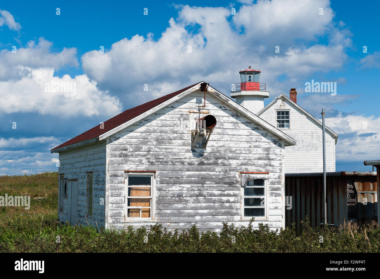 oldfashioned rustic house and lighthouse in LonguePointedeMingan