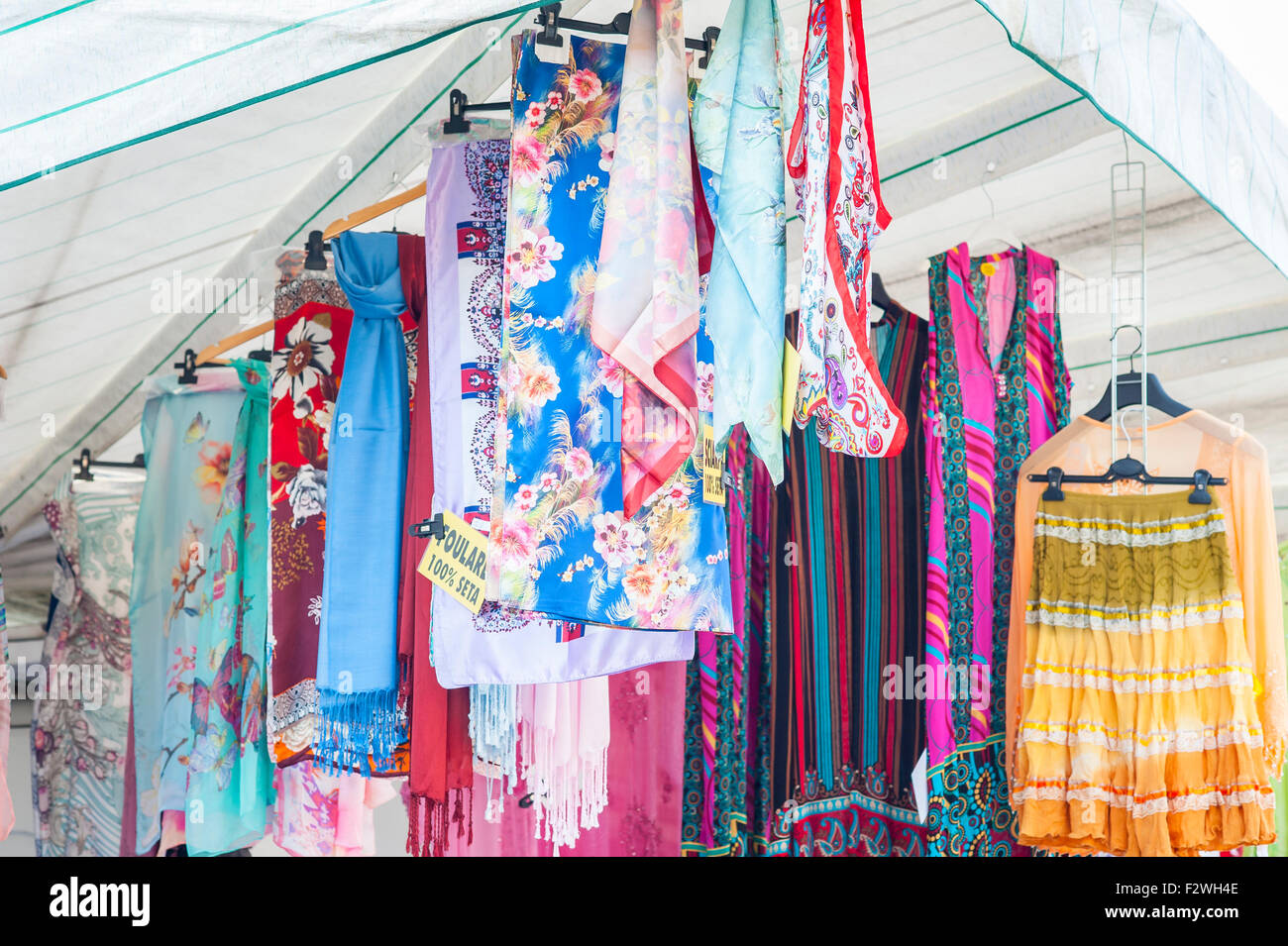 Shawl for women on sale at outdoor market. Italy Stock Photo