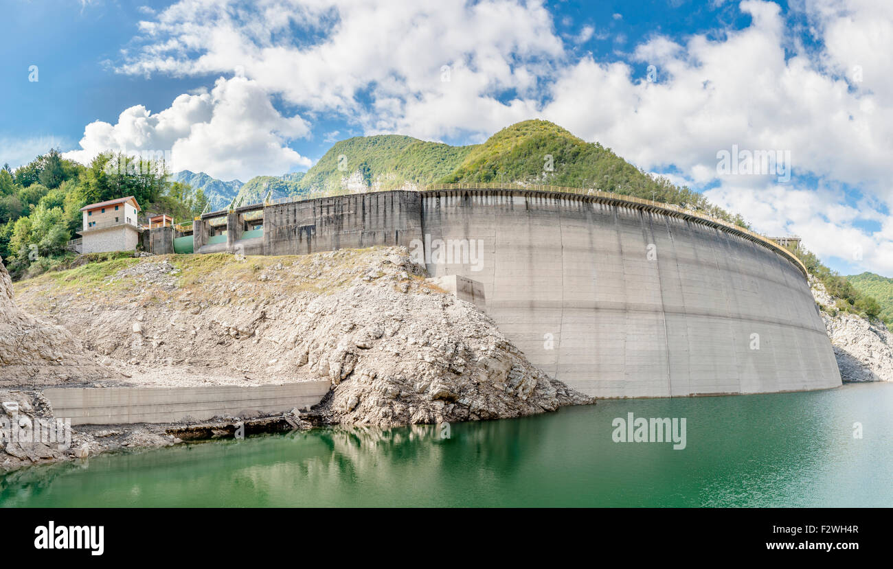 Landscape with dam for the production of electrical energy in the mountains Stock Photo