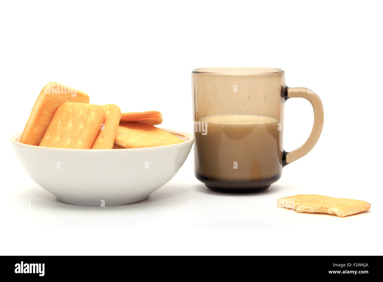 Crackers with a glass of milk on a white background Stock Photo Alamy