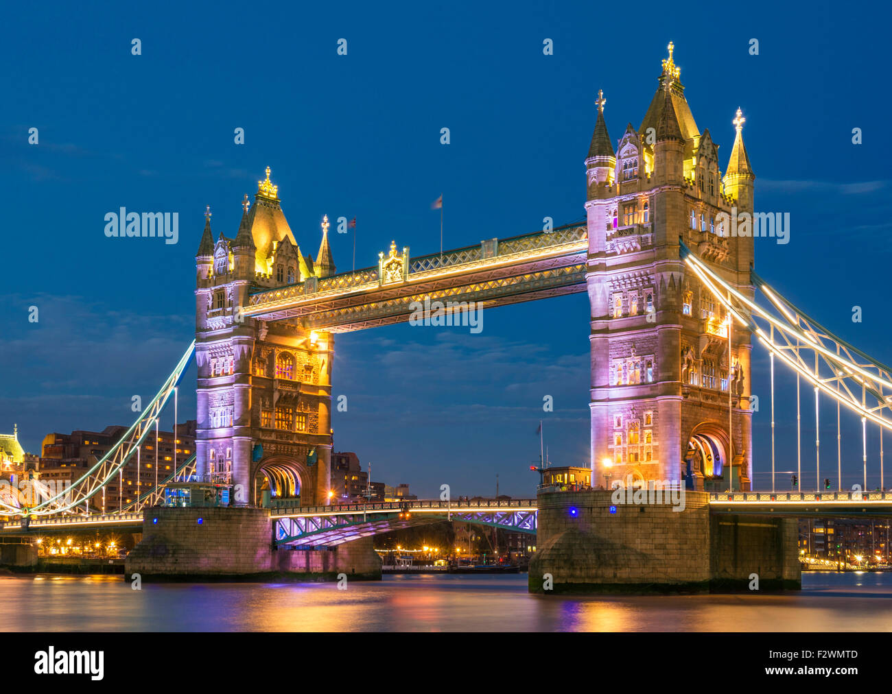 Illuminated lit up Tower Bridge at night and River Thames City of London England GB UK EU Europe Stock Photo