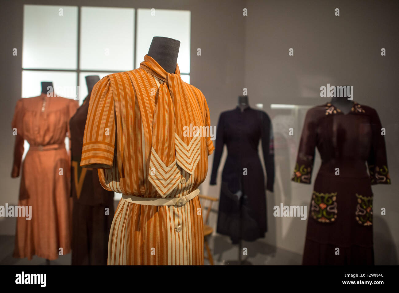 Elegant afternoon dresses of Jean Patou   from 1935 are on display  at the exhibition 'Gretchen mag's mondaen - Damenmode der 1930er Jahre' (lit. Gretchen likes it glamorous - women's fashion from the 1930s)at the town museum in Munich, Germany, 24 September 2015. The exhibition showscases women's fashion and accessoirs from the 1930s and runs from 24 September to 29 May 2016. Photo: Matthias Balk/dpa Stock Photo