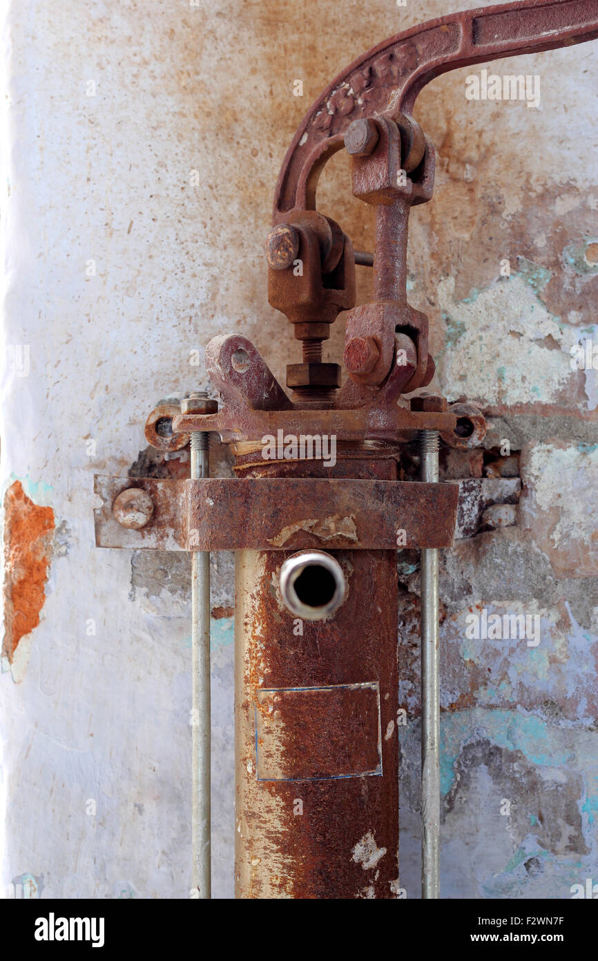 old rusty manual water pump Stock Photo