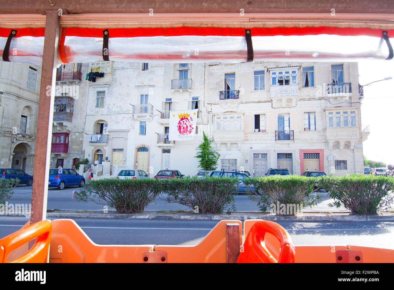 Valletta Football Club flag hanging from a balcony in the city Stock Photo