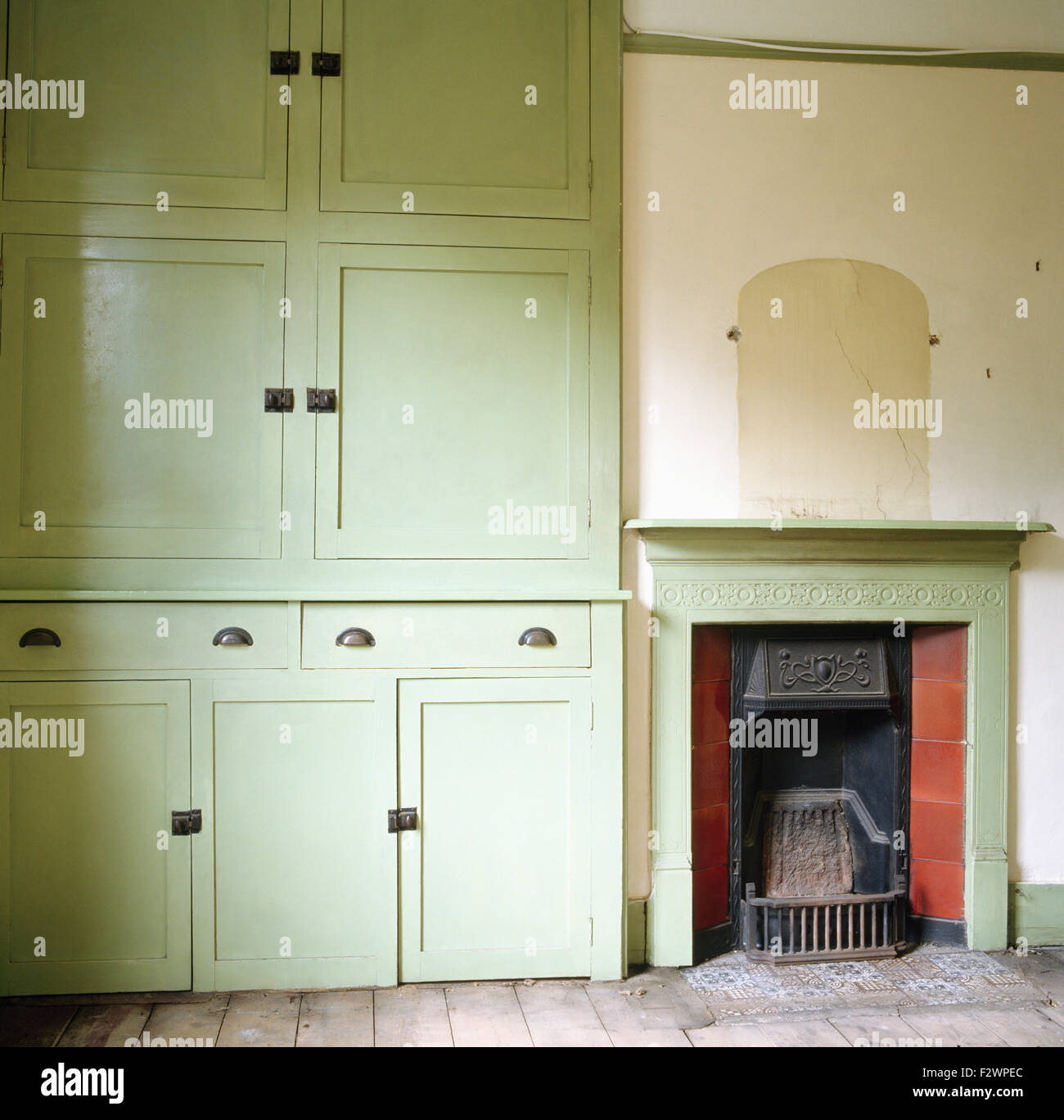 Pale Green Floor To Ceiling Cupboards In Dated Dining Room