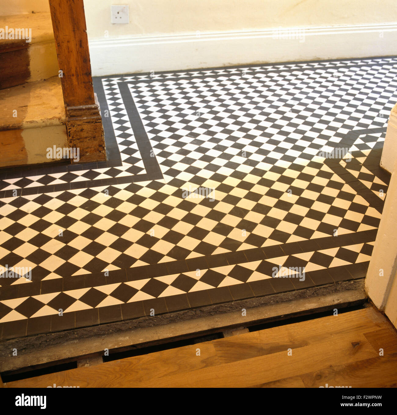 Close-up of newly laid black+white Victorian tiled floor Stock Photo