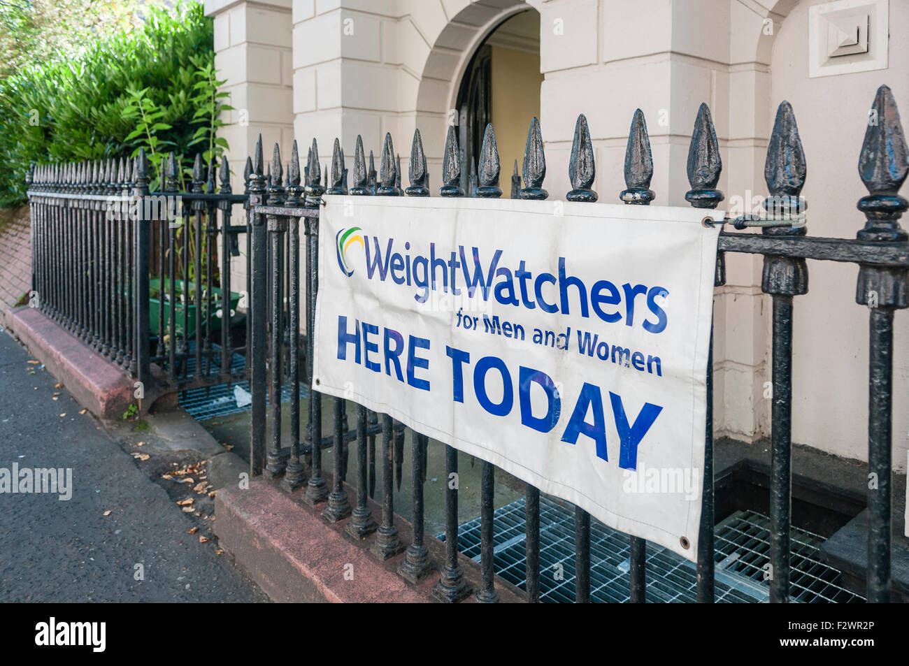 A sign informing the public that a WeightWatchers meeting is taking place in a venue today Stock Photo