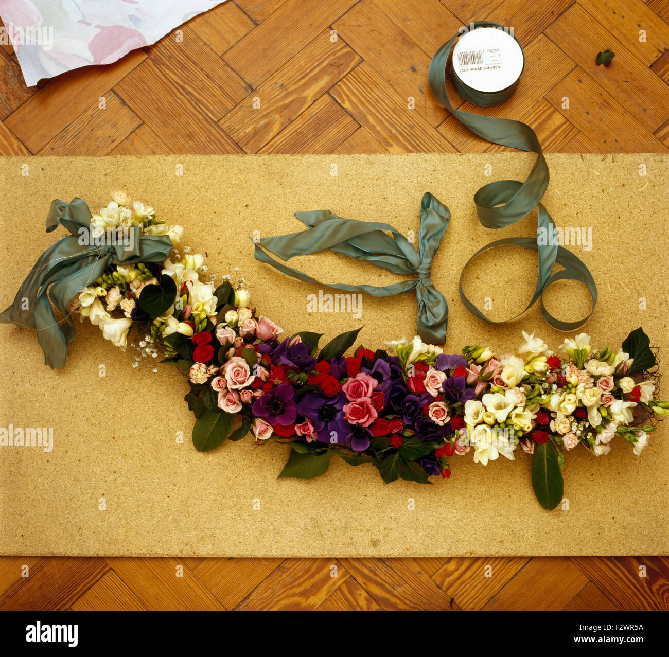 Making a fresh flower garland Stock Photo Alamy